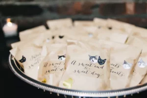 bowl of cat themed gift bags at wedding